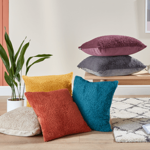 an image of a stack of different colour pillows 