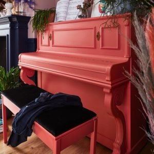 an image of a painted pink upcycled piano 