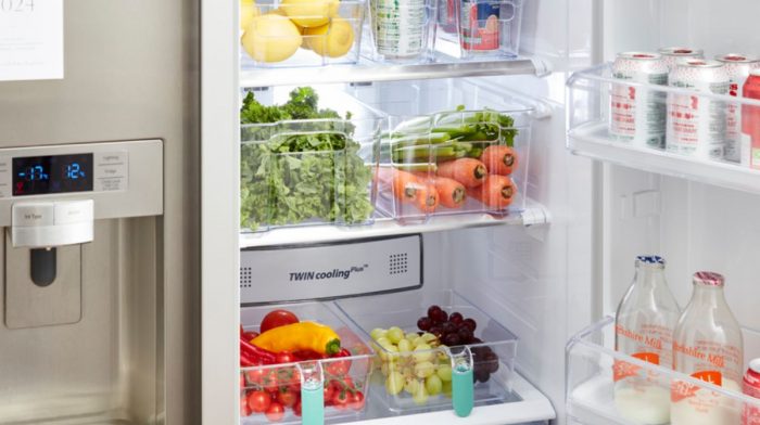 Clear plastic fridge storage with organised food