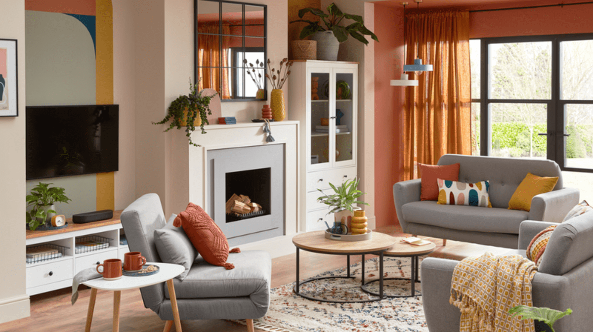 Bright living room decorated with colourful furniture and grey sofas.