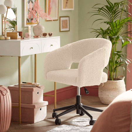 Fluffy white desk chair with wheels on the base.