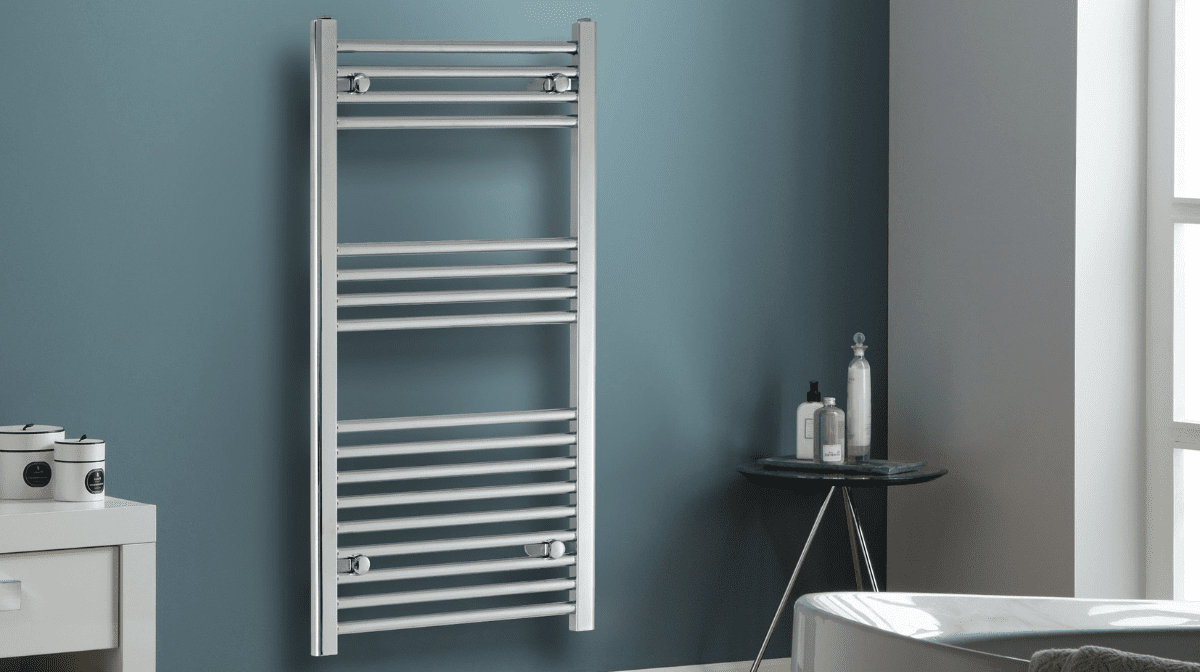Image of silver radiator in a teal bathroom