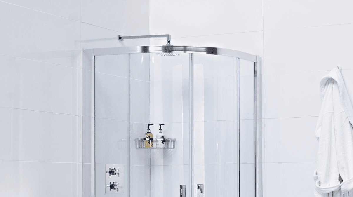 Image of a silver power shower in a white modern bathroom