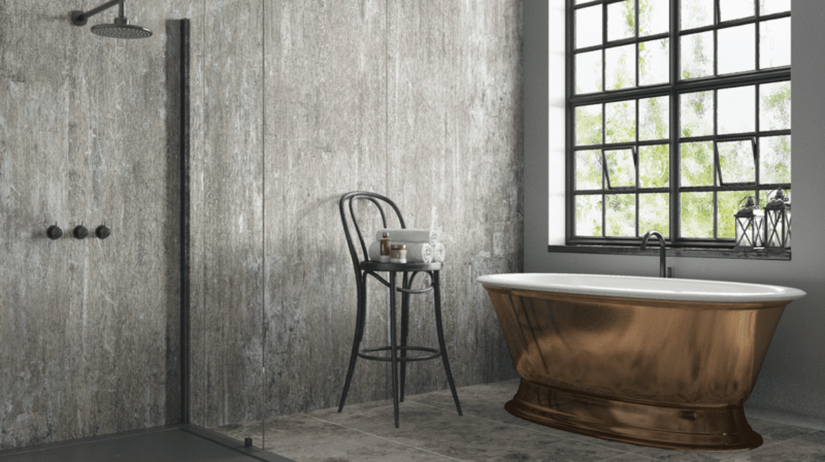 A image of a grey industrial bathroom with a copper bathtub