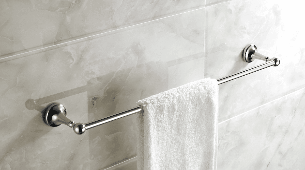 Silver towel rail with white towel