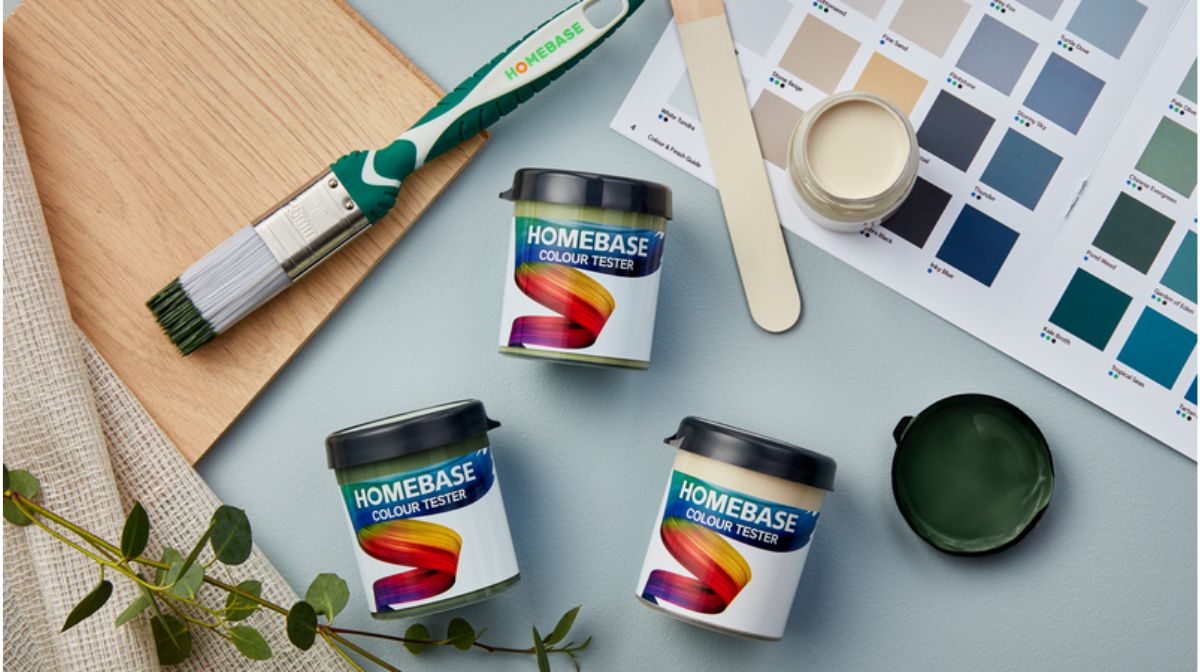 Image features Homebase paint tester pots and a colour chart against a pale blue background