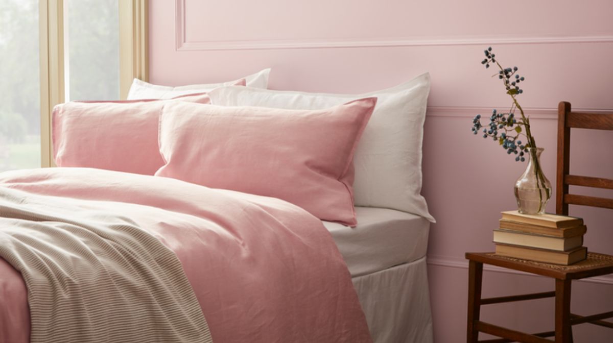 bed with pale pink bedding