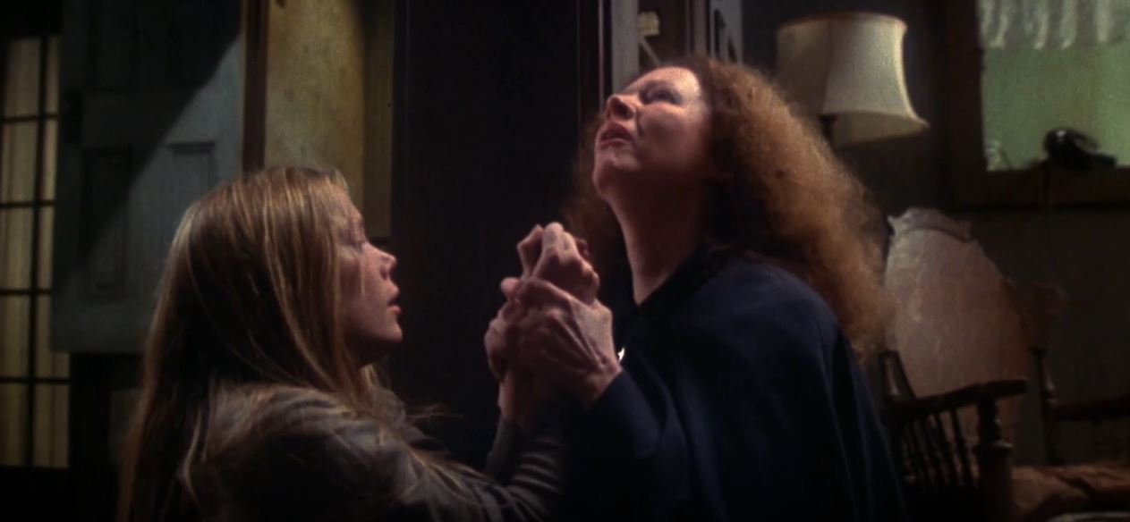 Carrie (Sissy Spacek) and her mother Margaret White (Piper Laurie) in Carrie (1976)
