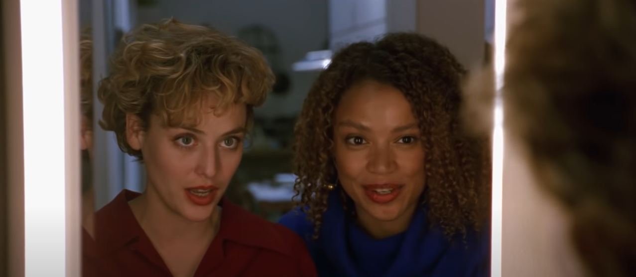 Helen (Virginia Madsen) and Bernadette (Kasi Lemmons) look in the mirror and dare to summon Candyman