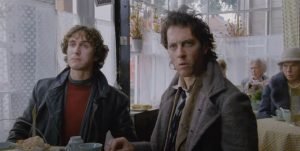Withnail (Richard E.Grant) and Marwood (Paul McGann) in a restaurant in Withnail and I (1987)