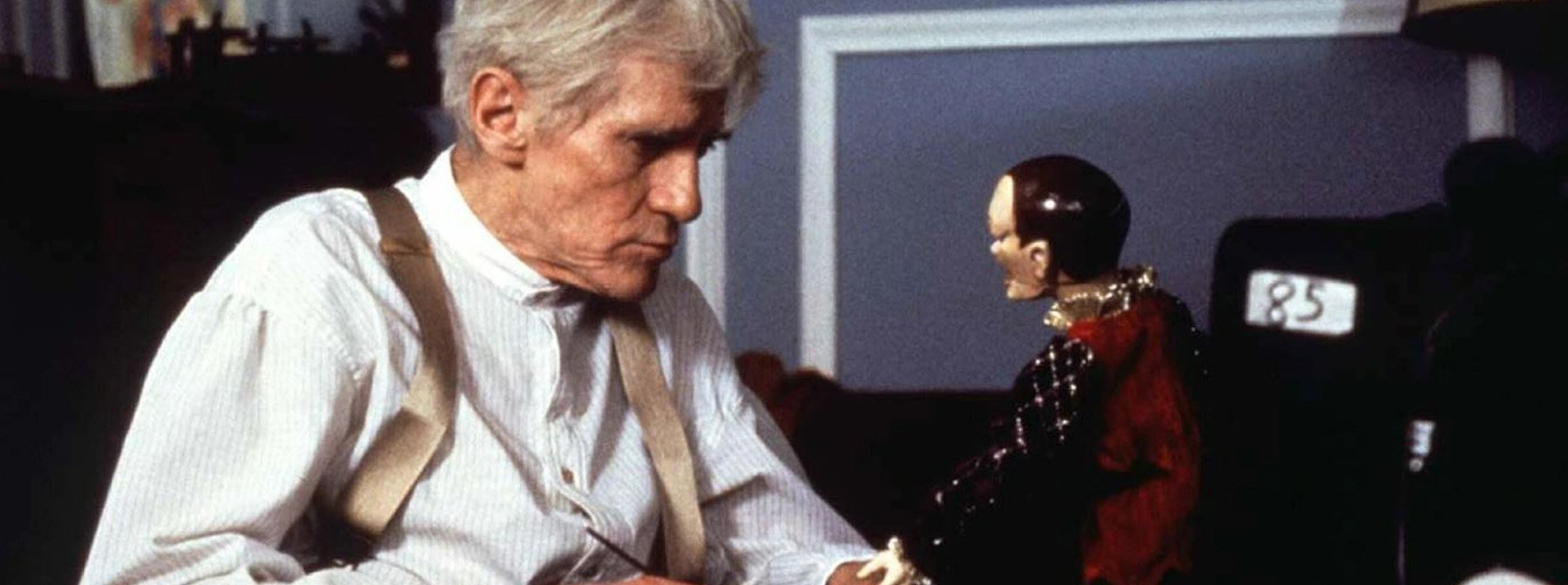 Andre Toulon (William Hickey) admires his puppet creation in Puppet Master (1989)