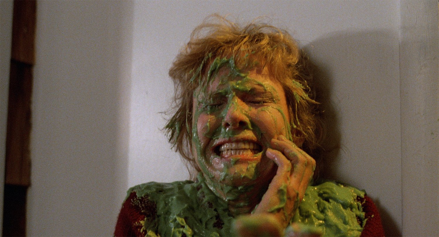 Miss Storm (Maureen Mooney) is covered in green slime as part of a prank in Hell High (1988)
