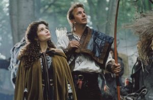 Robin (Kevin Costner) and Marian (Mary Mastrantonio) stand in Sherwood Forest in Robin Hood: Prince of Thieves (1991)