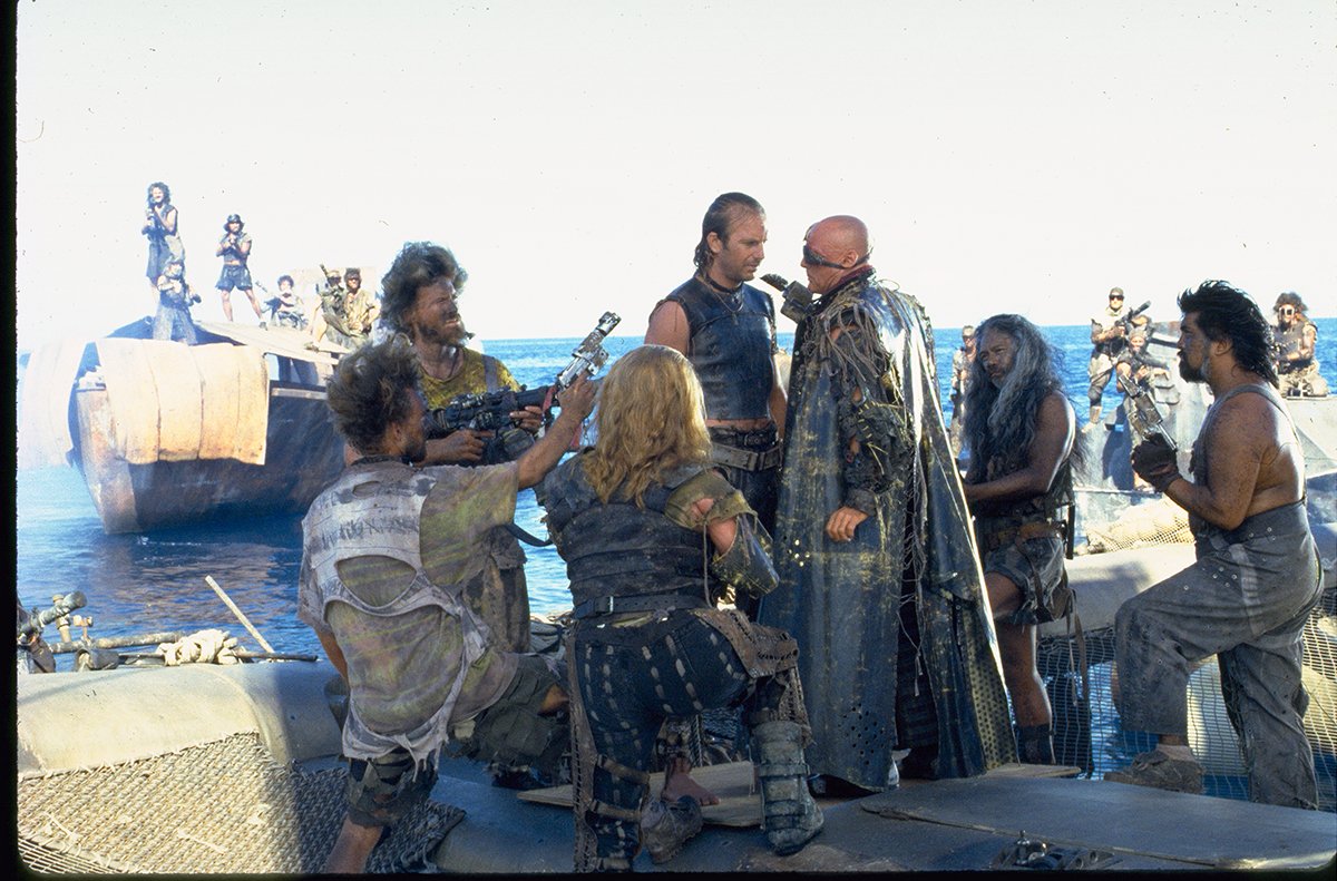 The Deacon (Dennis Hopper) confronts The Mariner (Kevin Costner) in Waterworld (1995)