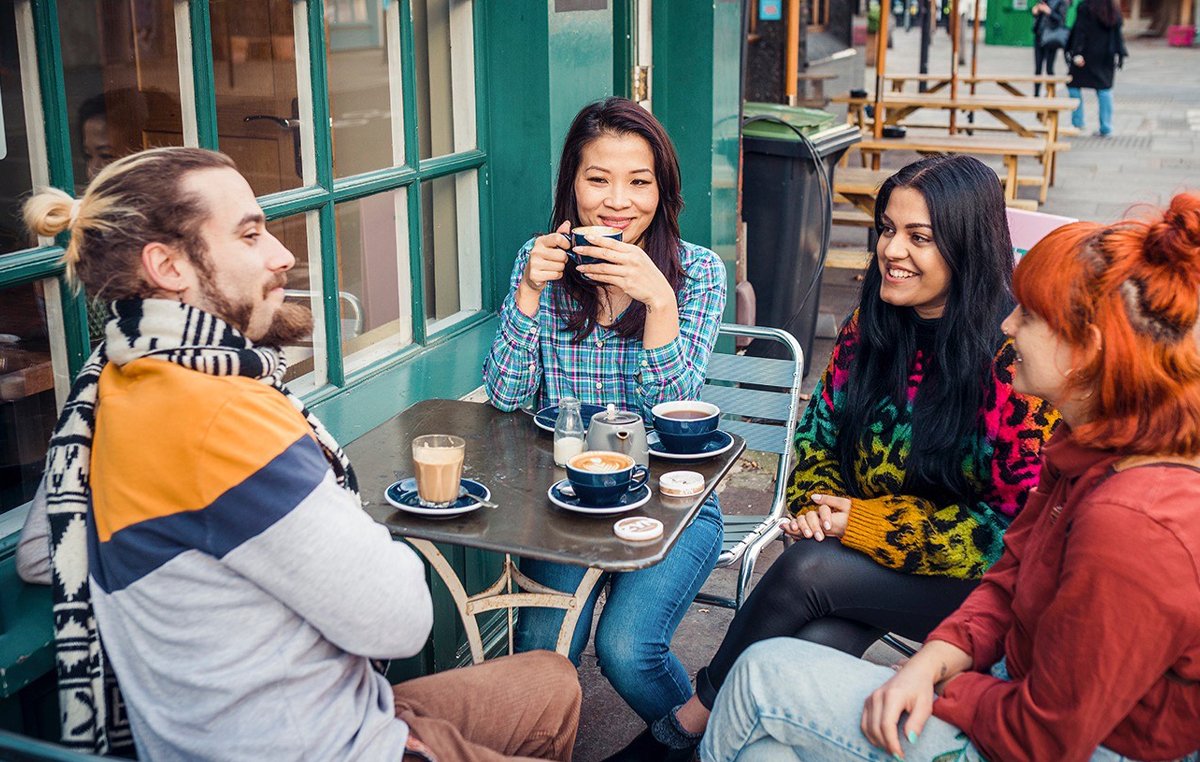 Group smile outside while enjoying ZYN