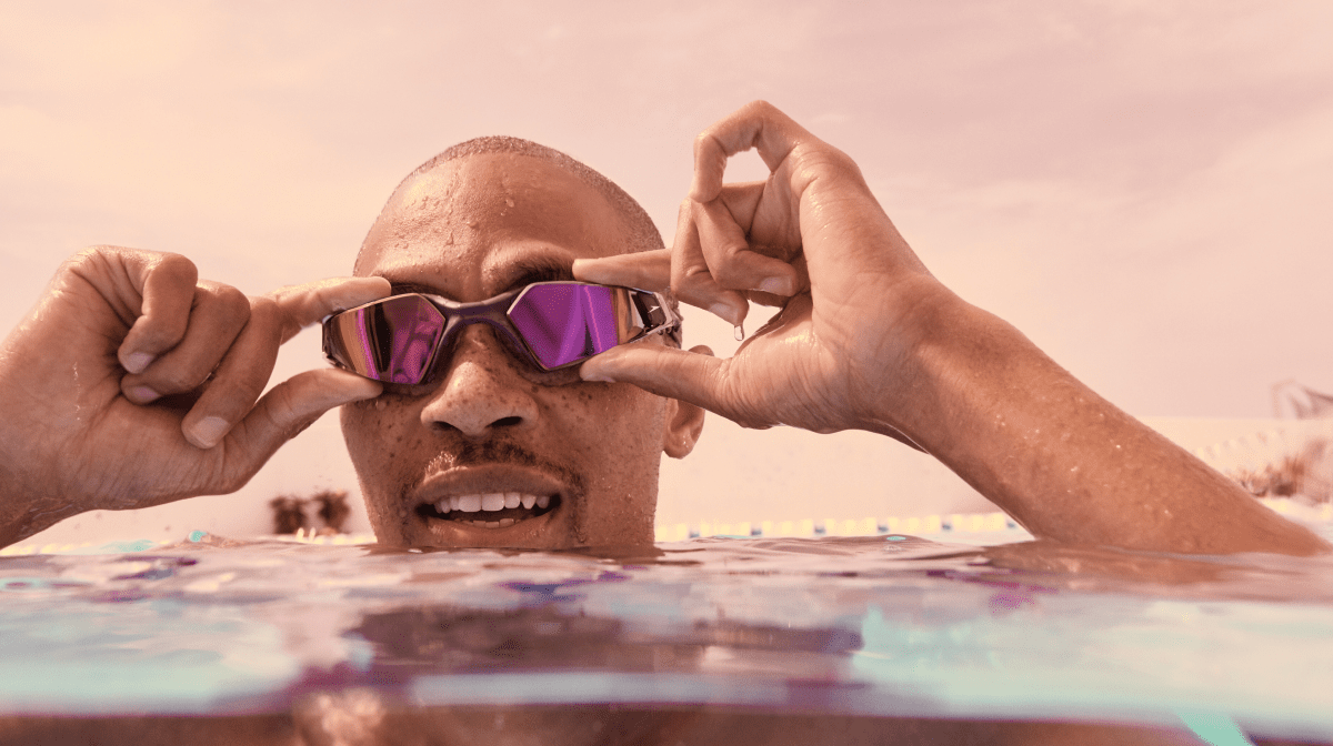 A man wearing Speedo goggles in water