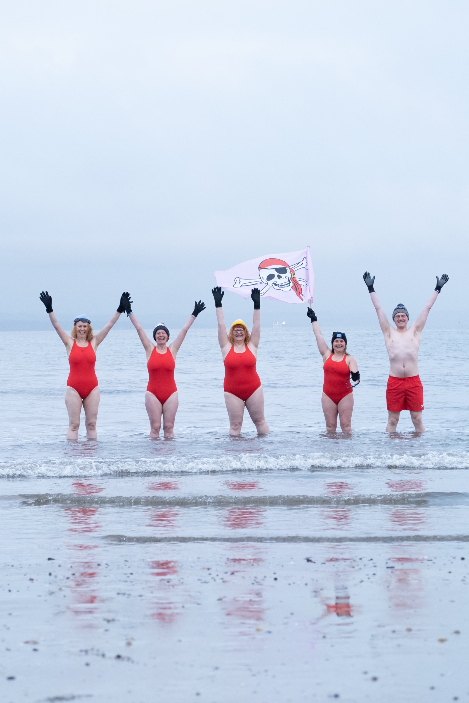 Speedo swimmers celebrate in the water