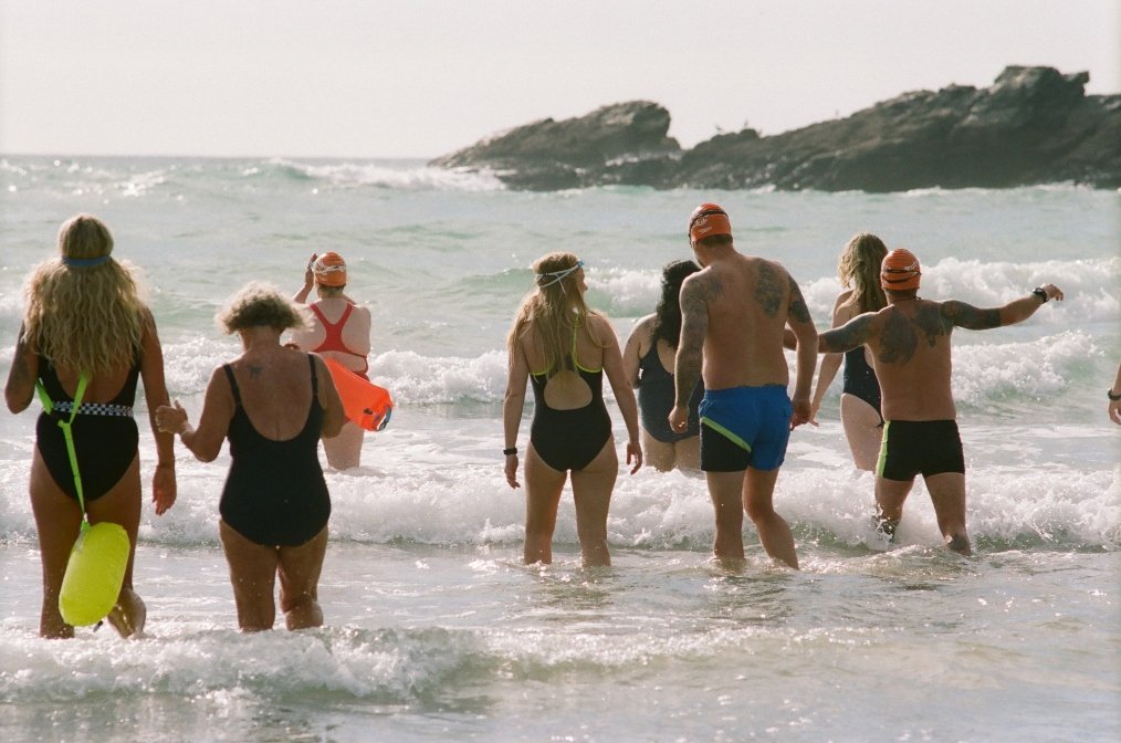 Speedo swimmers entering the sea