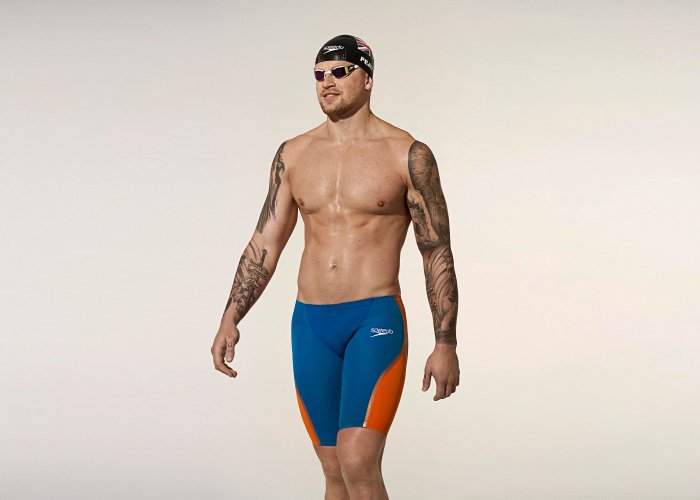 Adam Peaty walking in full Speedo swim apparel