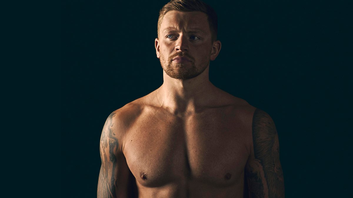 Adam Peaty close-up on black background