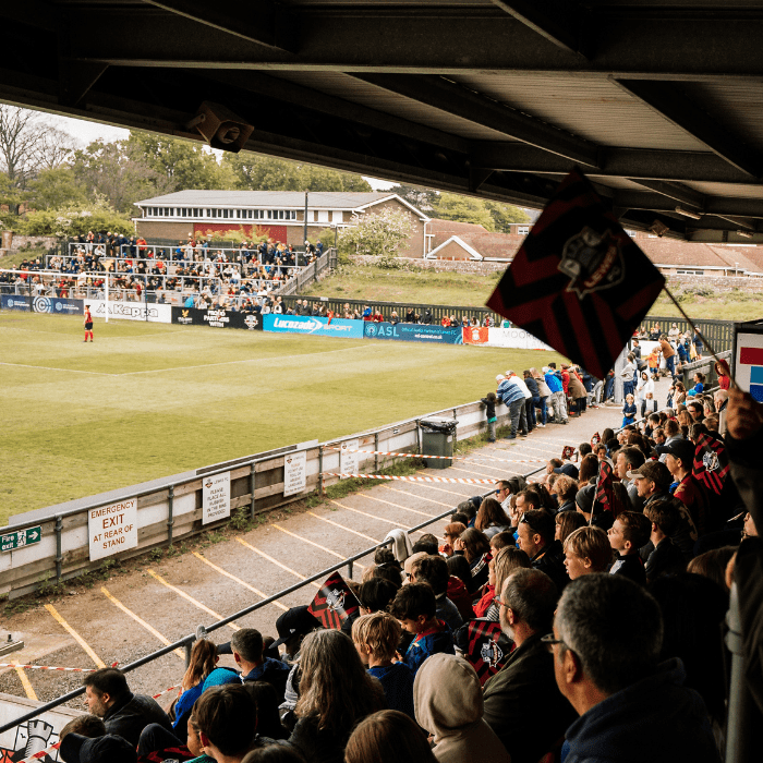 Lewes FC Women's fans cheering on their team at the Dripping Pan Stadium