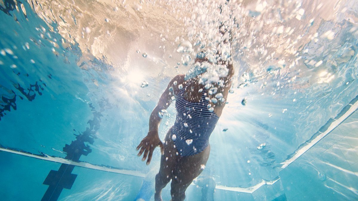 A woman swimming underwater