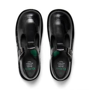 Overhead image of pair of black patent Kickers school shoes