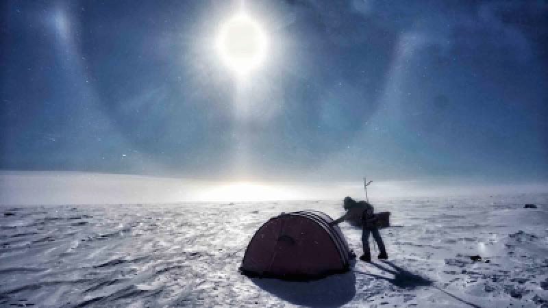 Man leans on igloo