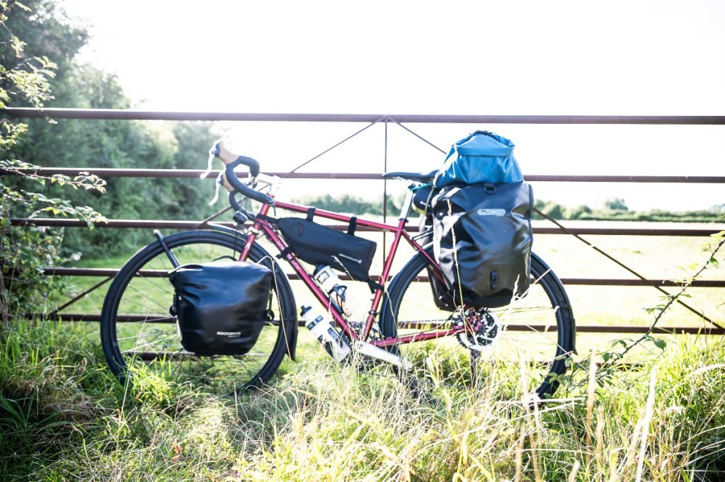 Bike leans against fence