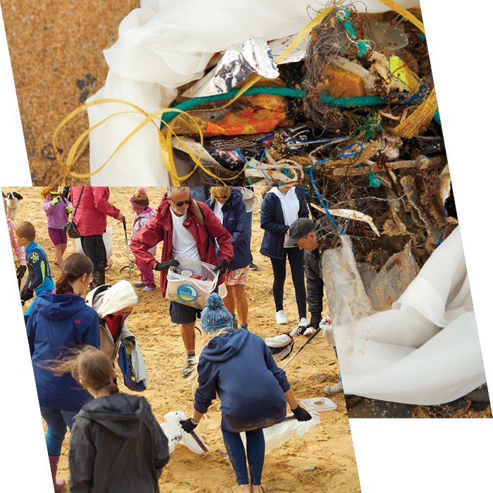 People stand in Berghaus jackets and jumper on a sandy beach