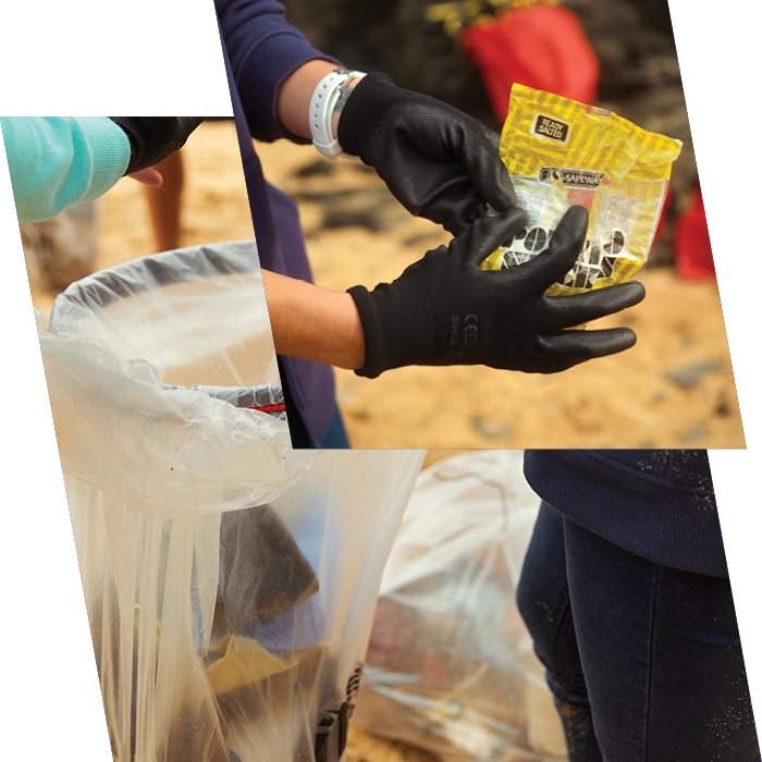 Person points to yellow bag of rubbish