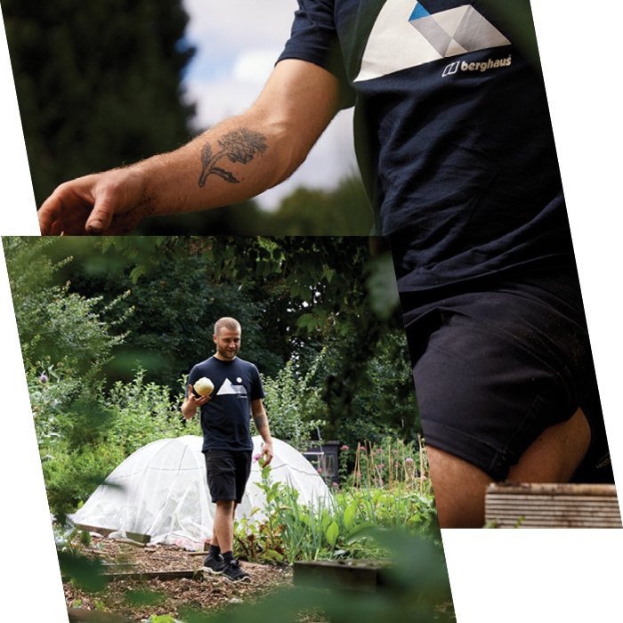 Man walks and hold lettuce in hand in Berghaus jumper