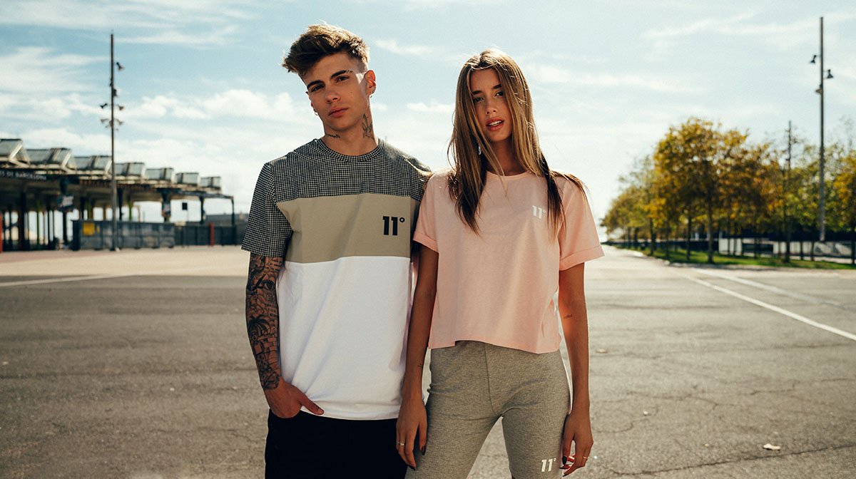 an image of a male and female wearing 11 Degrees clothing