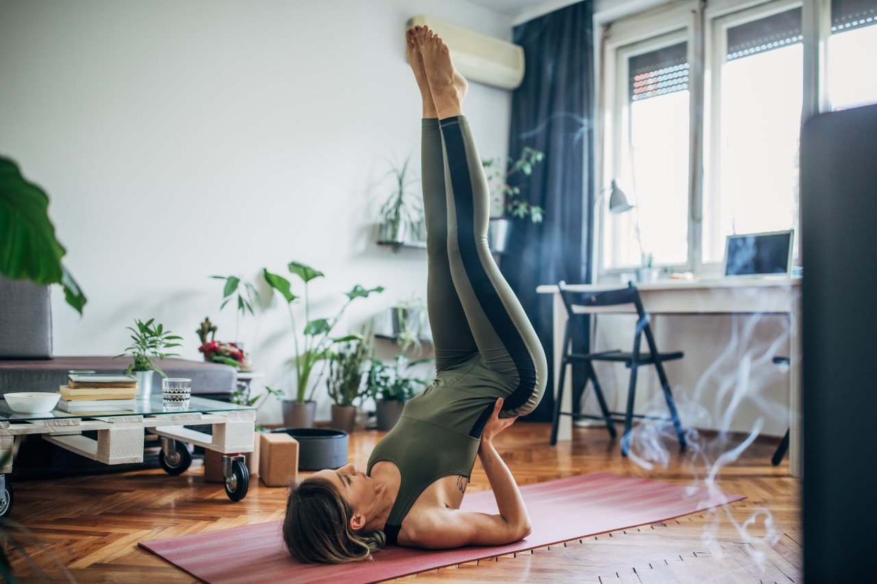 Woman doing yoga on floor