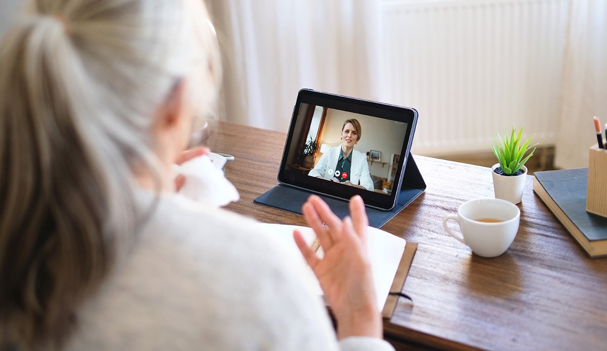 Woman speaks to doctor over video call