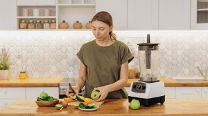 Woman slicing fruits in her kitchen