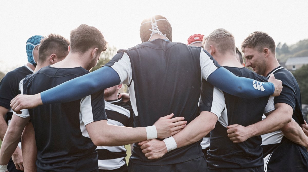 Rugby team in huddle