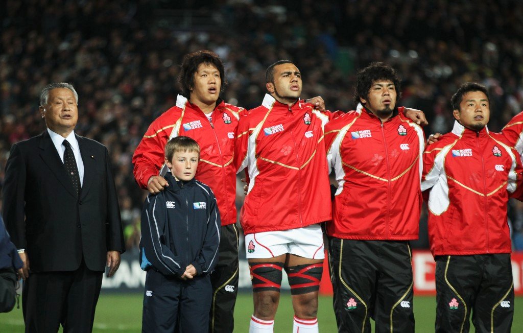 Japan sing national anthem