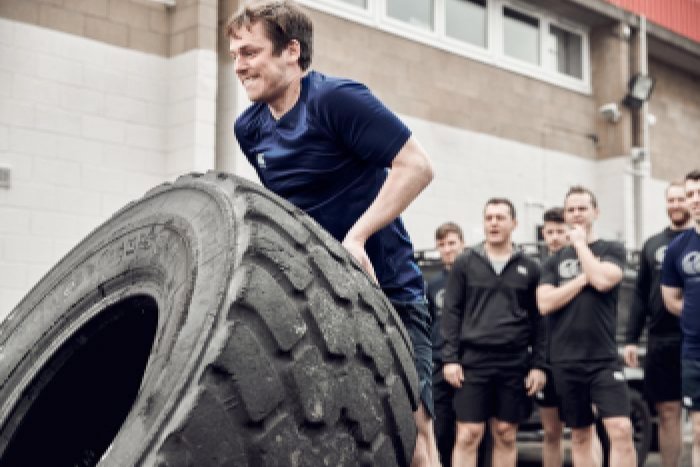 Person flipping tyre