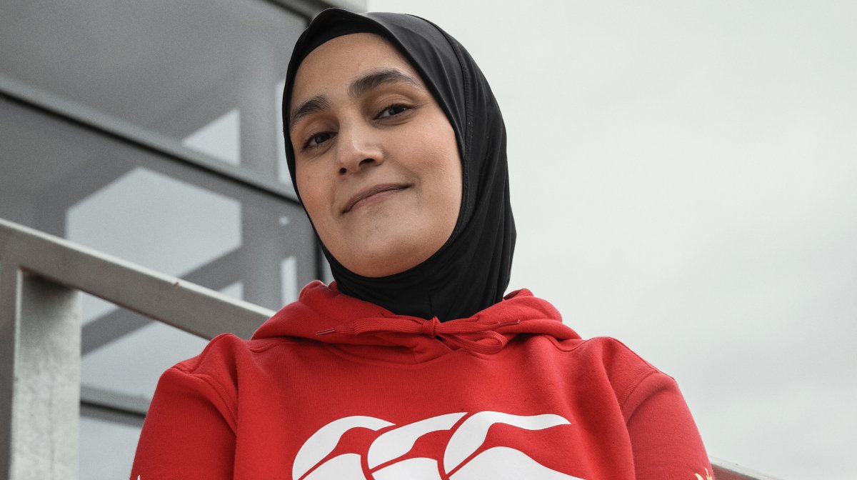 Close up of female rugby player in red Canterbury hoodie