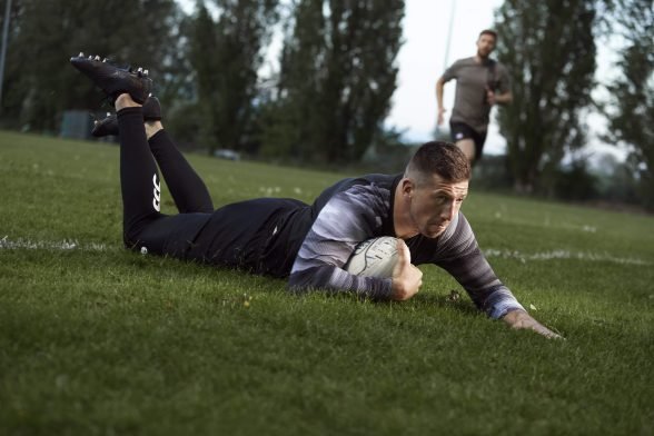 Justin Tipuric completing a rugby tackle