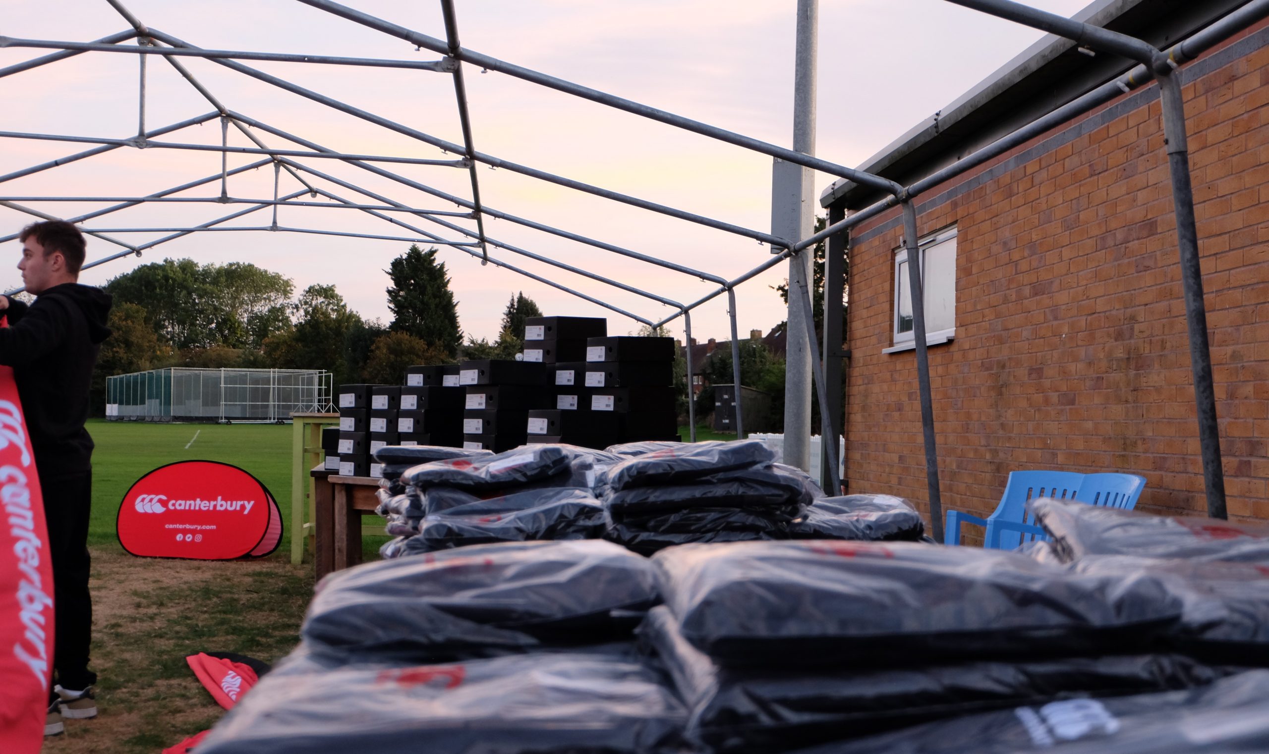 Canterbury apparel piled along side of clubhouse