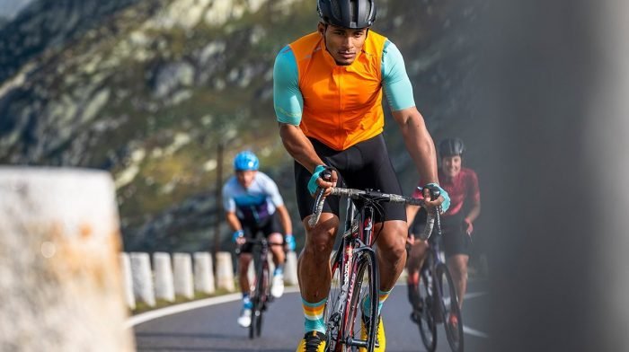Man accelerating uphill in Endura cycling gear