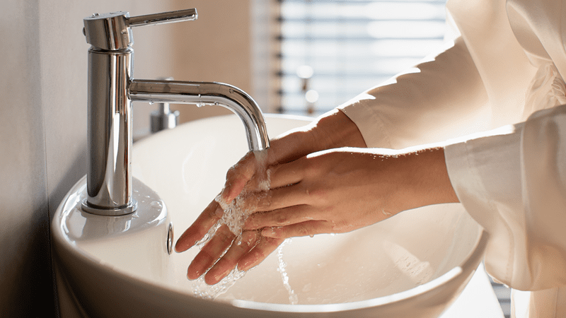 woman washing hands  