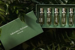 laboratory perfume collection against green folliage