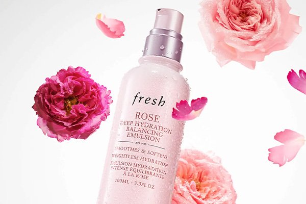 fresh rose emulsion surrounded by petals and roses