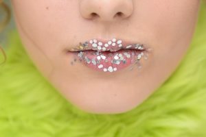 model with glitter on her lips