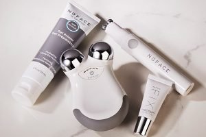 nuface skincare tool, surrounded by three nuface skin care products