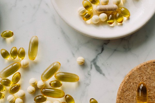 a bowl of supplements on a table top 