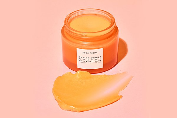 Product in the middle of page, Glow Recipe's Papaya Enzyme Cleansing Balm spread below